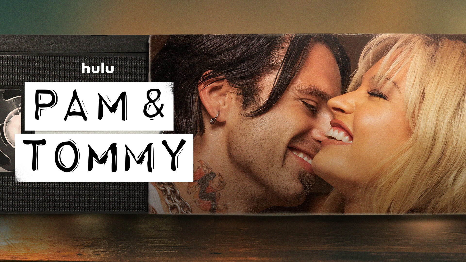 Pam & Tommy -- Set in the Wild West early days of the Internet, PAM & TOMMY tells the incredible true story of the Pam Anderson (LILY JAMES) and Tommy Lee (SEBASTIAN STAN) sex tape. Stolen from the couple’s home by a disgruntled carpenter (SETH ROGEN), the video went from underground bootleg-VHS curiosity to full-blown global sensation when it hit the Web in 1997. A love story, crime caper and cautionary tale rolled into one, the eight-part Hulu limited series explores the intersection of privacy, technology and celebrity, tracing the origins of our current Reality TV Era to a tape seen by millions but meant to have an audience of just two. Pam (Lily James) and Tommy (Sebastian Stan), shown. (Courtesy of Hulu)